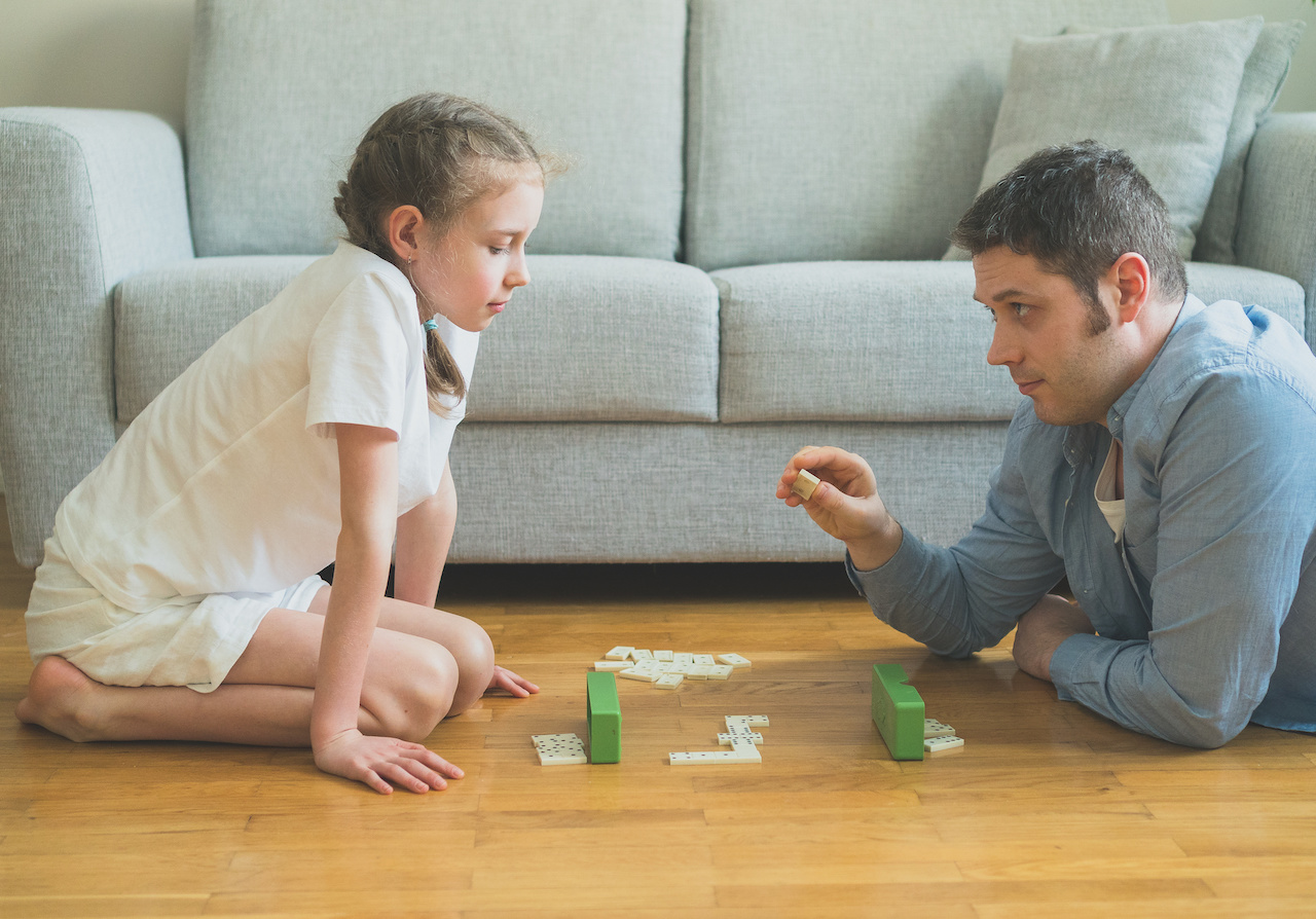 Kids playing dominoes