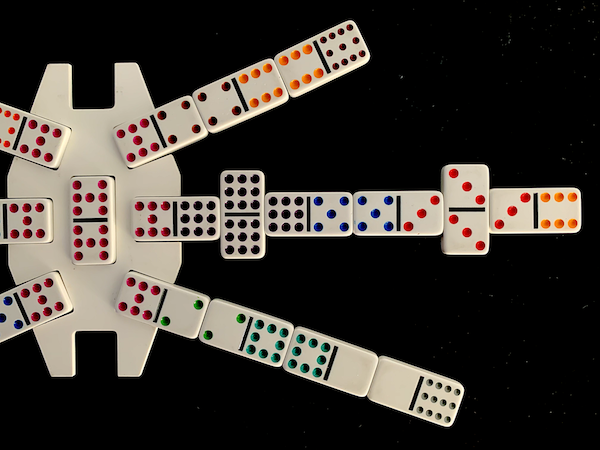 image of a line of dominoes with double nine and double three